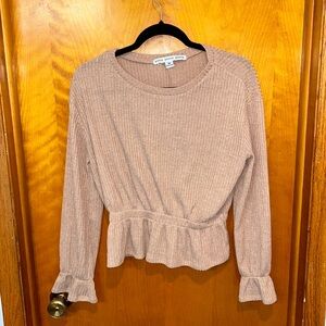 Peplum style long sleeve top